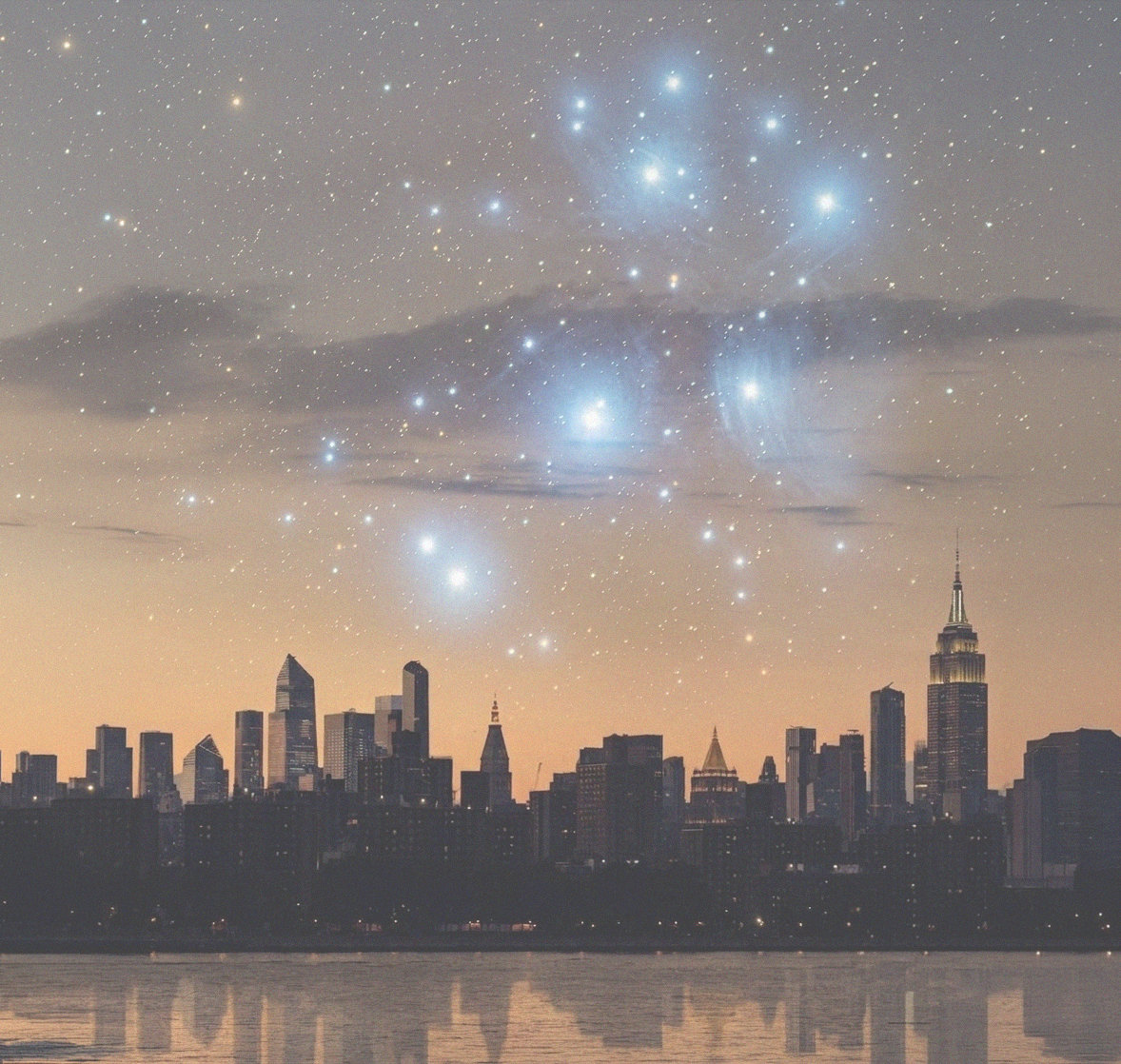A city skyline beneath a bright star field.